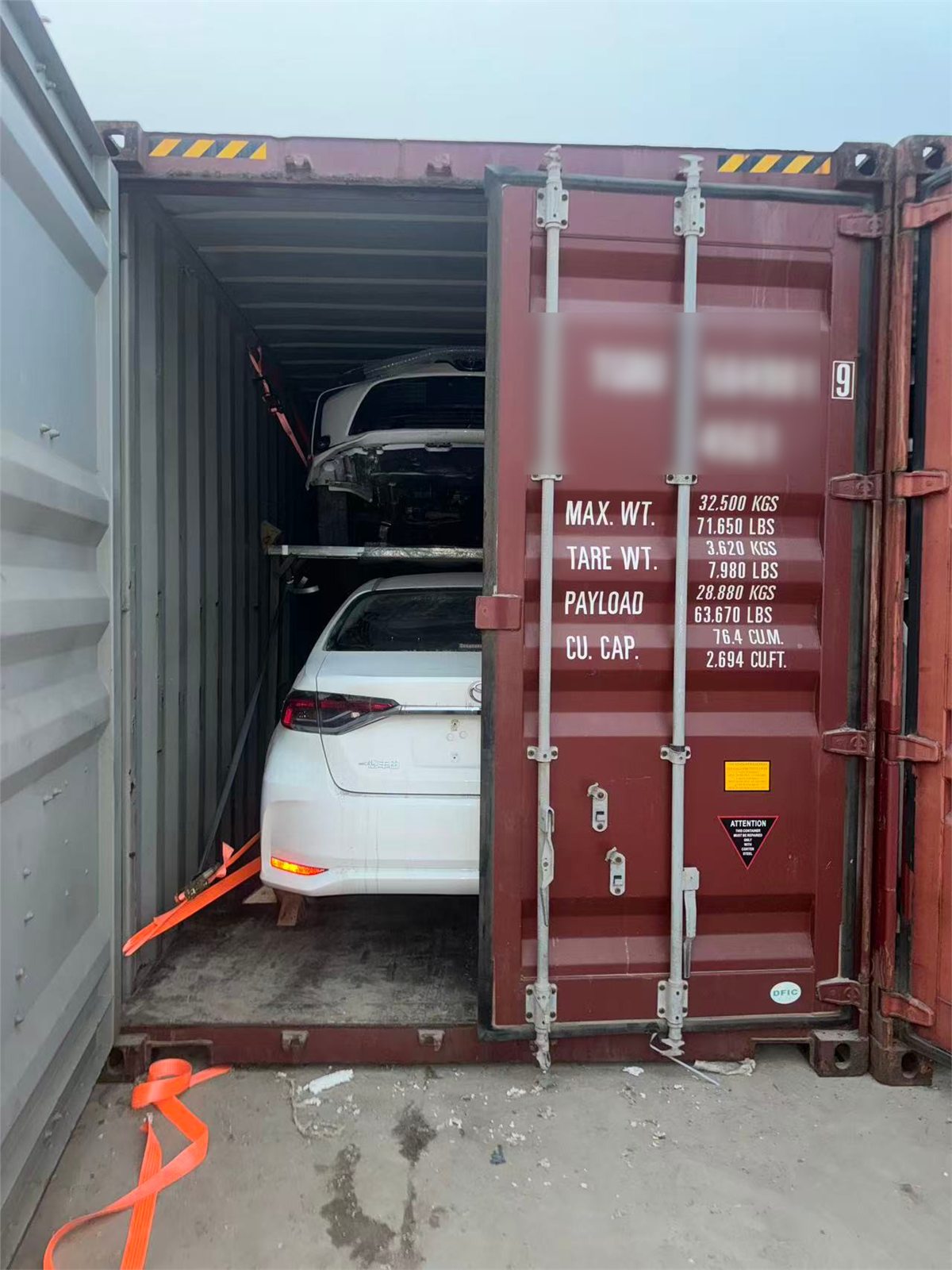 Loaded vehicles checked before a shipping container is closed